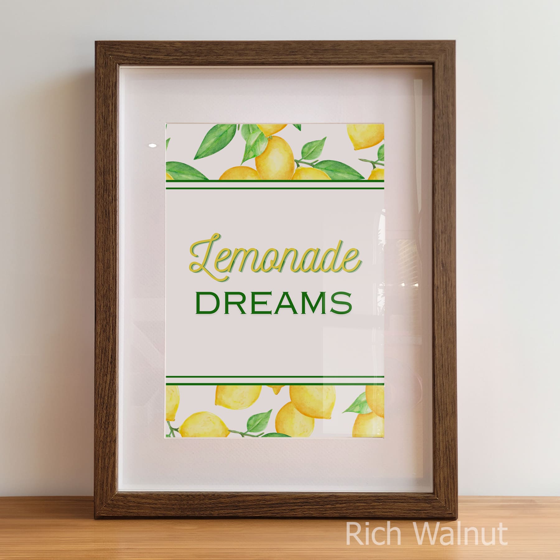 Framed print with 'Lemonade Dreams' text and lemon illustrations on a white background.