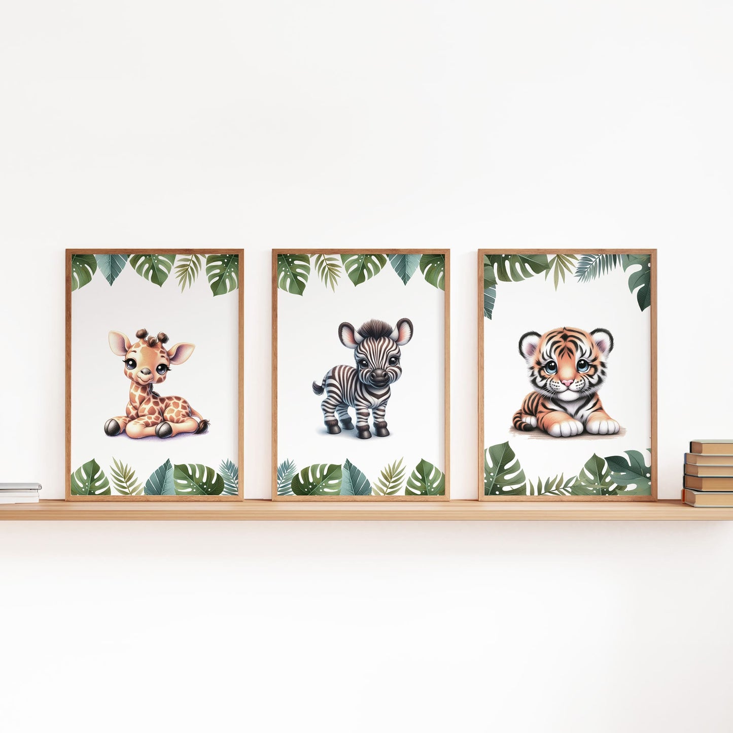 Second three of a set of six A4 prints featuring safari animals - lion cub, tiger cub, cheetah cub, elephant, giraffe, and zebra. The animals are depicted as baby animals, in a cartoony and bright style reminiscent of coloured pencil drawings. Jungle-style leaves adorn the edges of the prints.