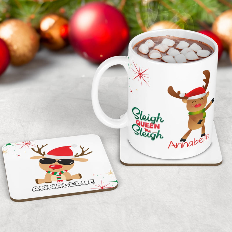 Childrens Christmas dinner set - mug, coaster and placemat. Featuring funky reindeer designs - one with earrings, one dancing and one with cool shades on. &quot;Sleigh Queen Sleigh&quot; quote, and personalised with childs name