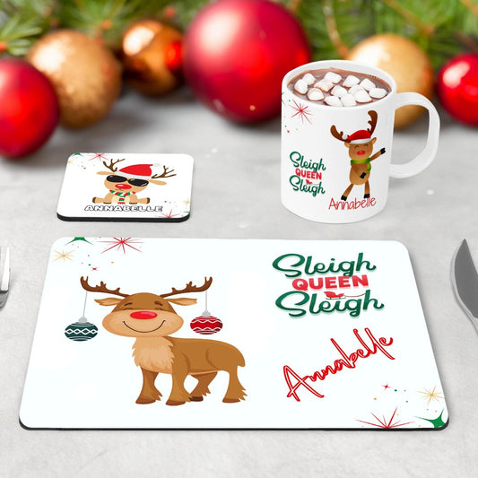 Childrens Christmas dinner set - mug, coaster and placemat. Featuring funky reindeer designs - one with earrings, one dancing and one with cool shades on. Sleigh Queen Sleigh quote and personalised with childs name