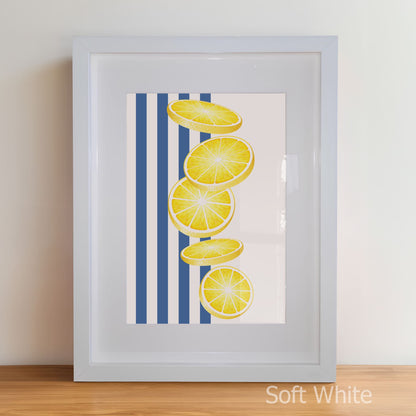Framed artwork with lemon slices on a blue striped background
