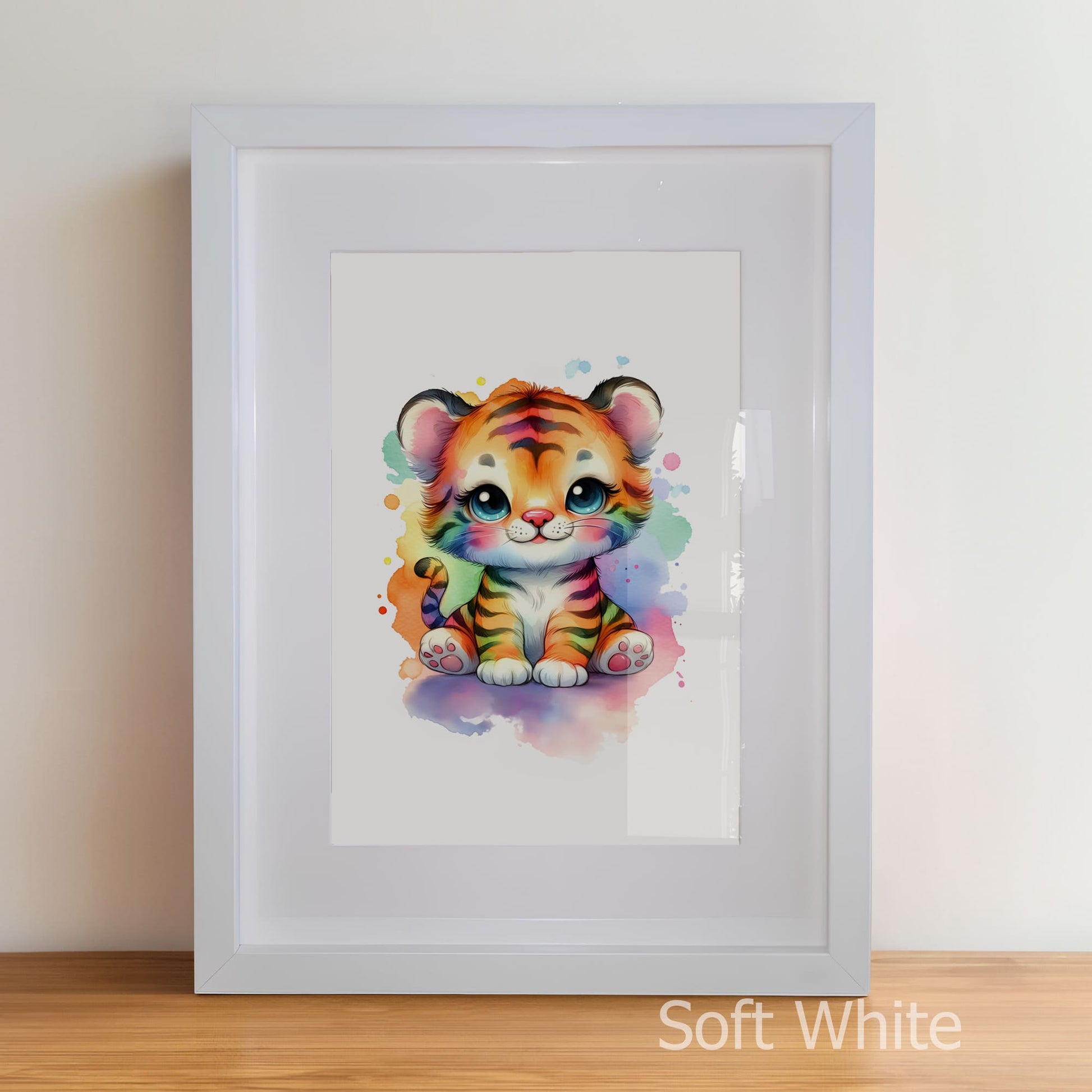 Framed artwork of a colorful tiger cub on a white wall.