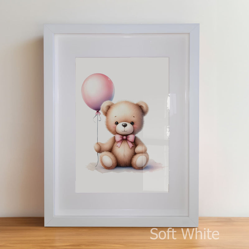 Framed artwork of a teddy bear with a pink balloon on a plain background
