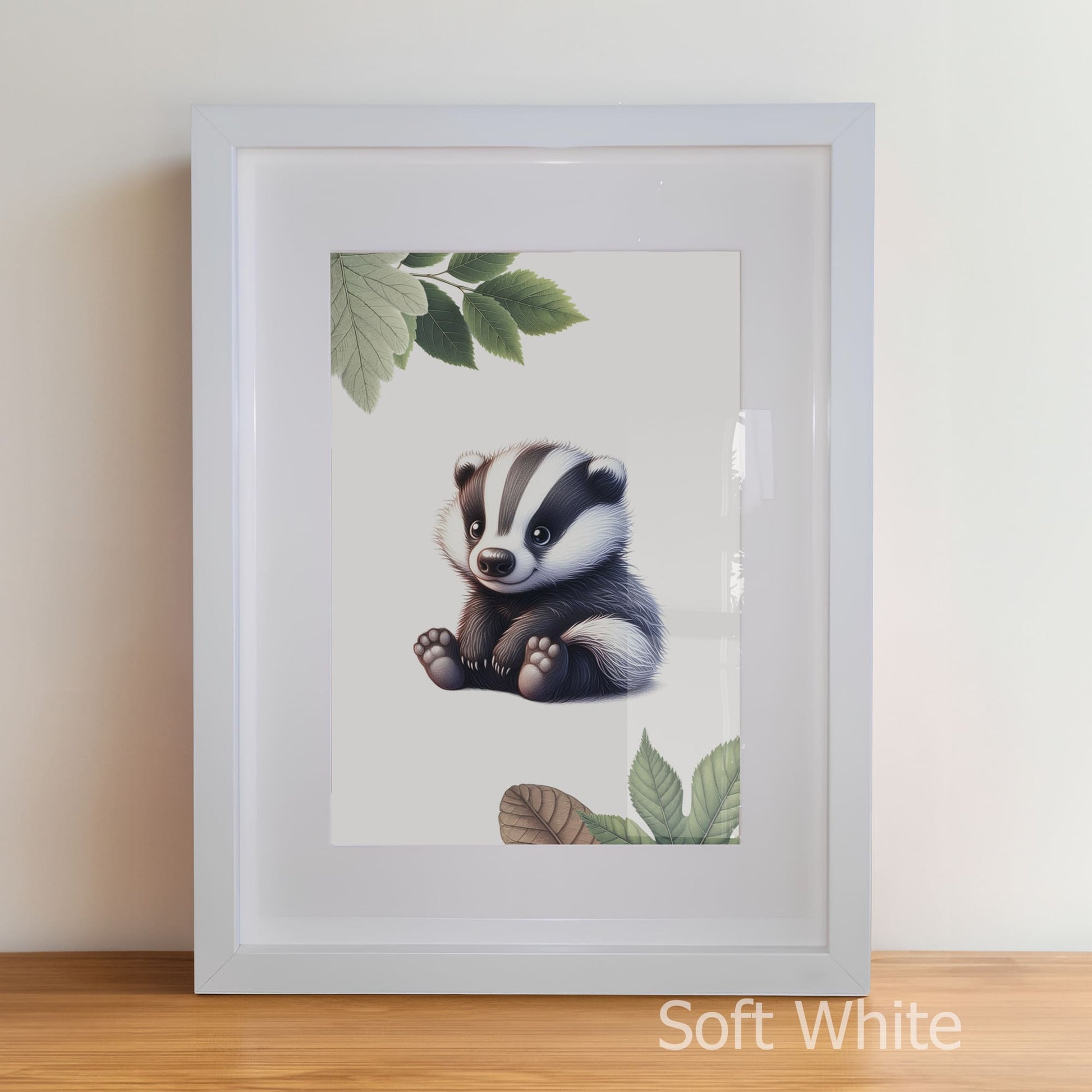 Framed artwork of a badger with leaves on a white wall.