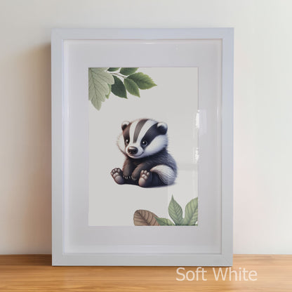 Framed artwork of a badger with leaves on a white wall.