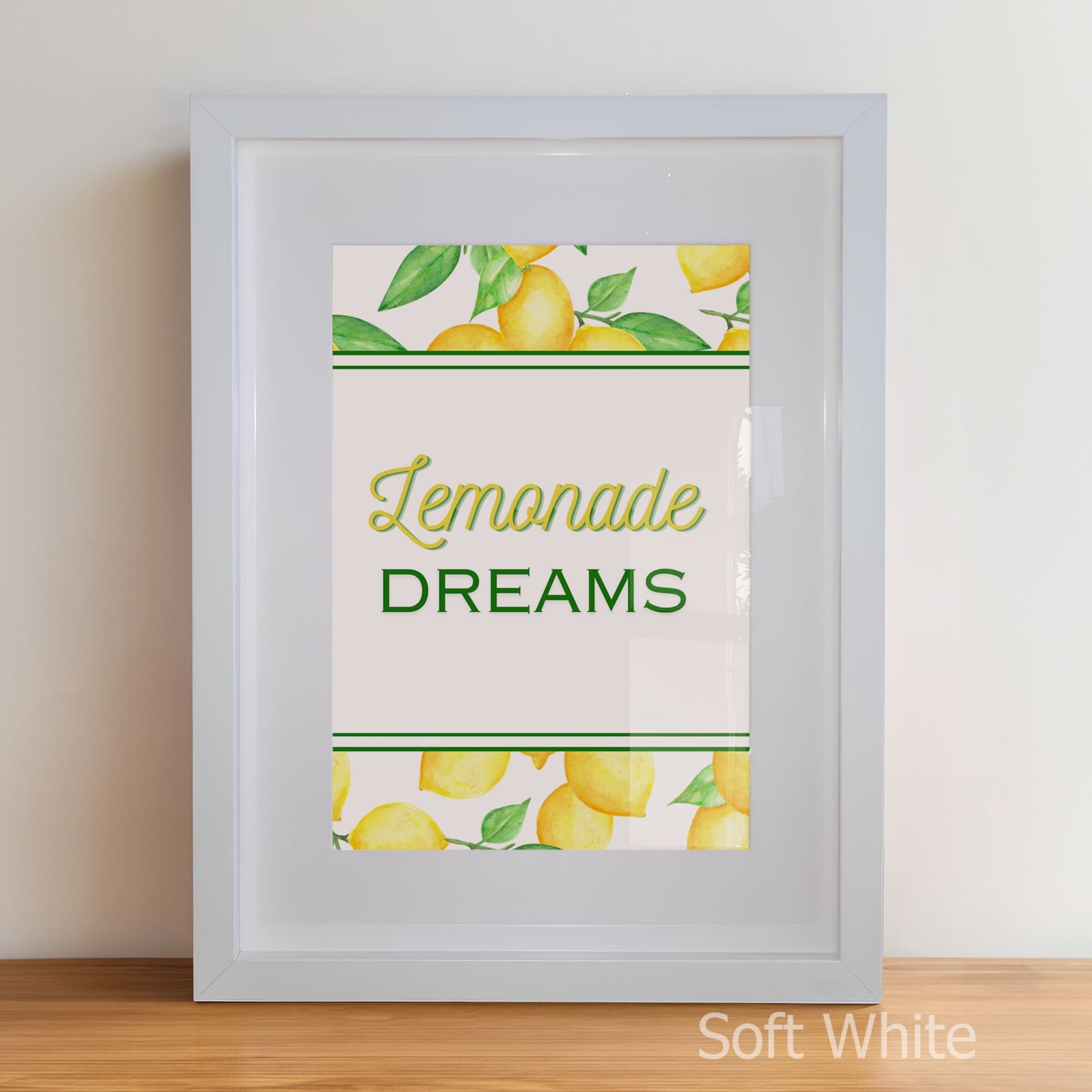 Framed artwork with 'Lemonade Dreams' text and lemon illustrations on a white background.