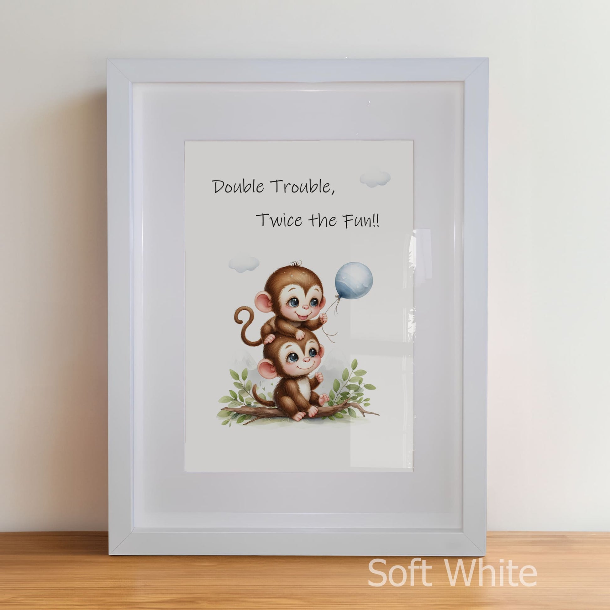Framed artwork with two monkeys and a balloon, text 'Double Trouble, Twice the Fun!!' on a white background.