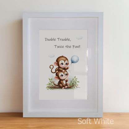 Framed artwork with two monkeys and a balloon, text 'Double Trouble, Twice the Fun!!' on a white background.