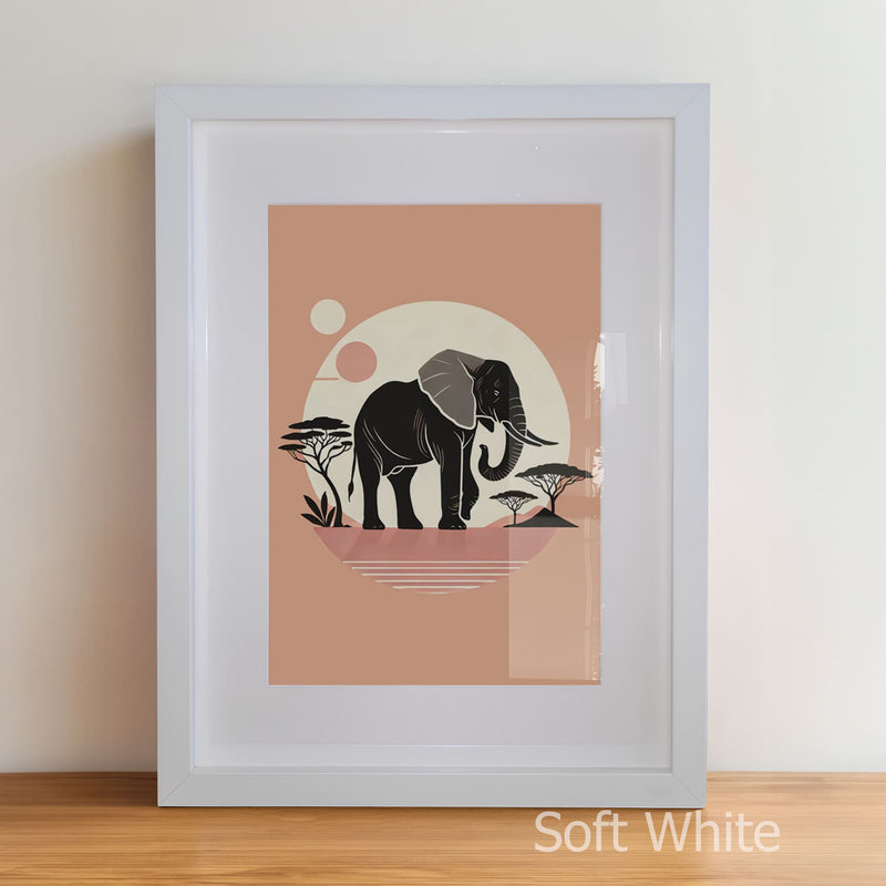 Framed artwork of an elephant with a sunset and trees on a peach background.