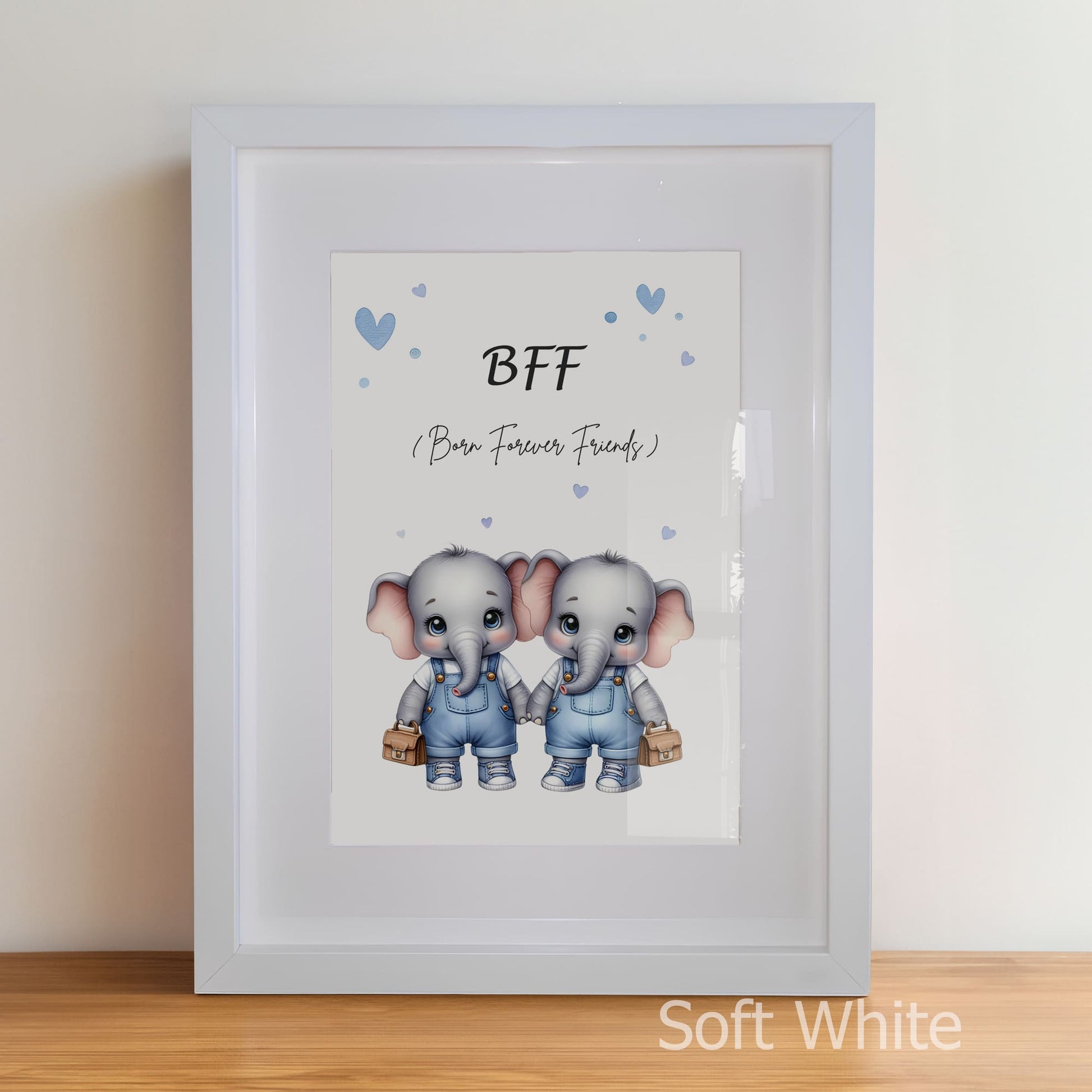 Framed artwork with two elephants holding hands and the text 'BFF (Born Forever Friends)' on a white background.
