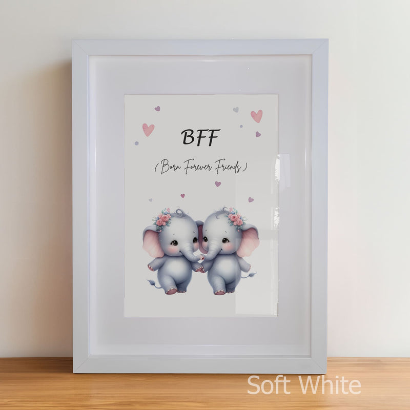 Framed artwork with two elephants holding hands and 'BFF' text on a light background