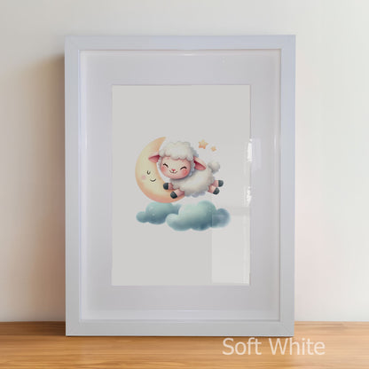 Framed artwork of a cartoon sheep on a moon with a soft white border.