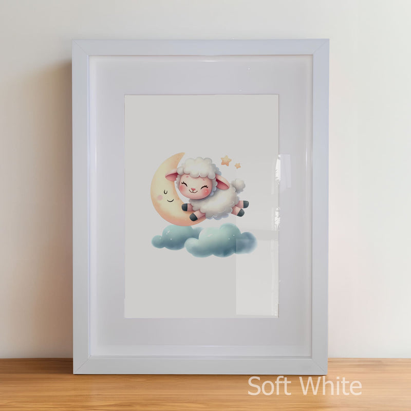 Framed artwork of a cartoon sheep on a moon with a soft white border.
