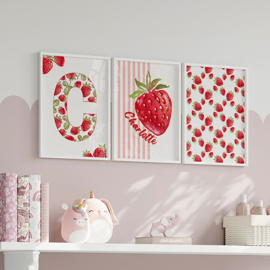 Strawberry nursery wall art set – includes a personalised name print with pink stripes and strawberry illustration, a full alphabet initial filled with strawberries, and a repeating fruit pattern. Custom room decor, ideal for baby nursery or toddler bedroom.