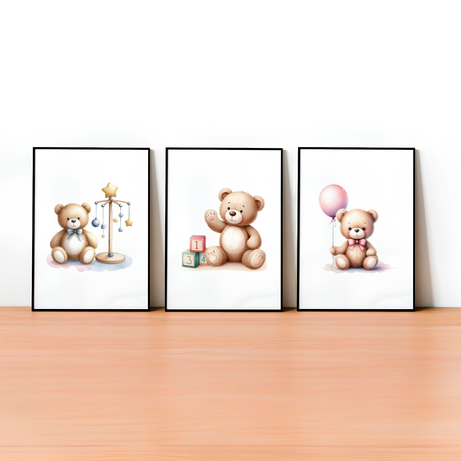 Set of three A4 prints in watercolour style. Each print depicts a teddy bear in a different scene: one teddy bear is holding a balloon, another is surrounded by counting blocks, and the third is near a mobile.