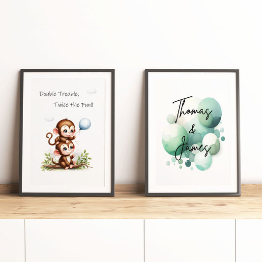 Set of 2 personalised prints for twins' nursery décor. One print features two cute monkeys playing, while the other showcases vibrant watercolour splashes overlaid with children's names in bold black lettering