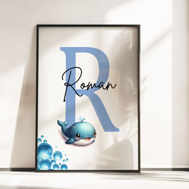 Set of three A4 prints featuring baby ocean animals - whale, shark, and octopus. The animals are depicted in a cute, cartoony, bright style resembling coloured pencil drawings. Blue bubbles decorate the edges of the prints. The middle print features a smaller animal than the others, with a large initial letter in the background. A personalised name in black overlays the initial letter.