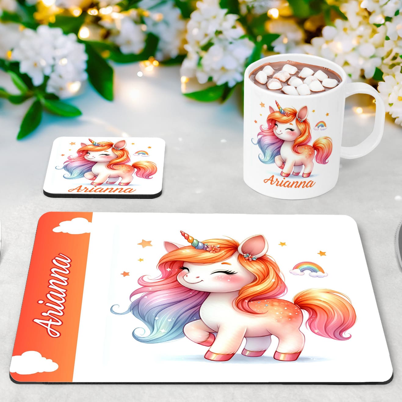 Vibrant warm tones unicorn design on a white placemat, coaster and mug set. All items personalised with childs name in orange