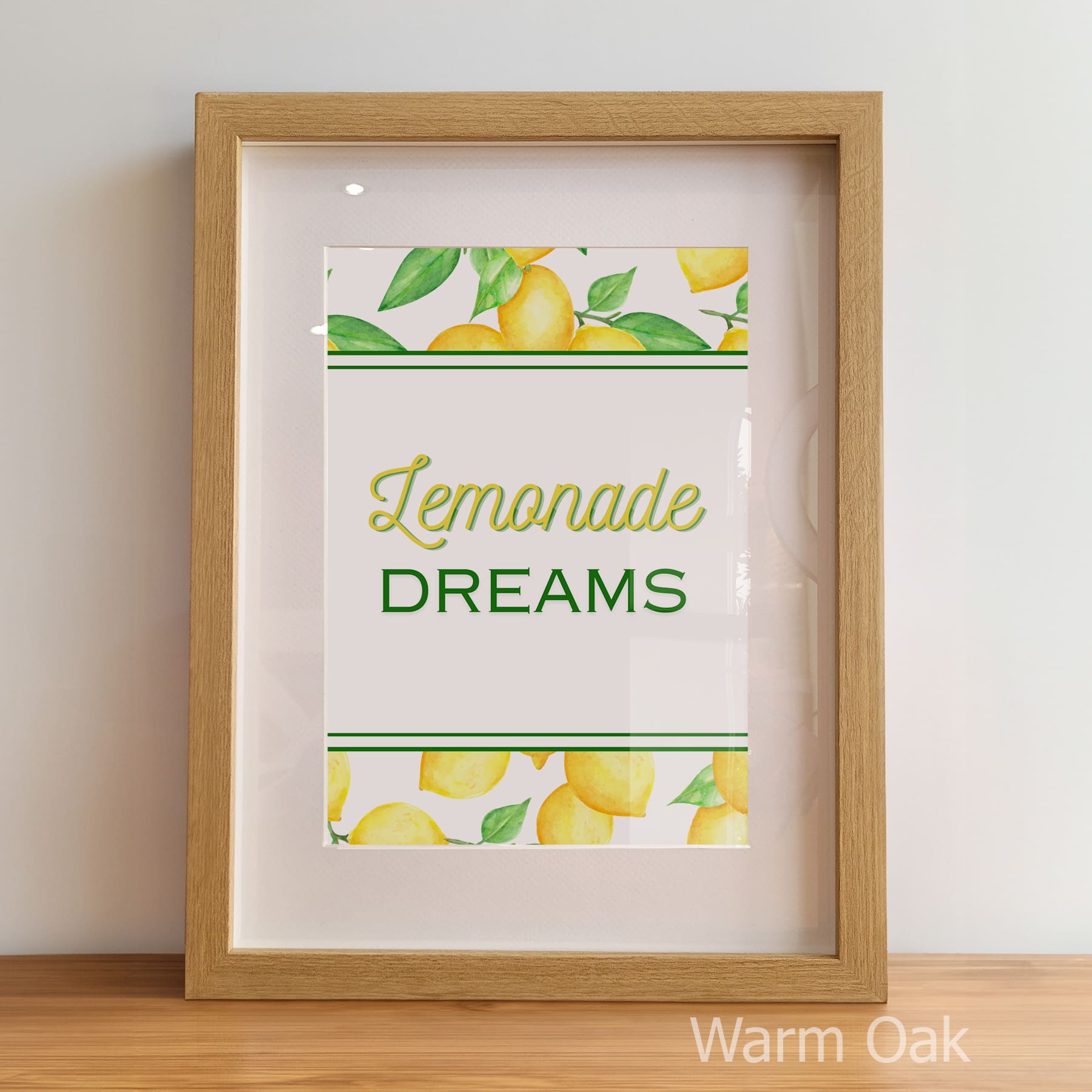 Framed print with 'Lemonade Dreams' text and lemon illustrations on a white background.