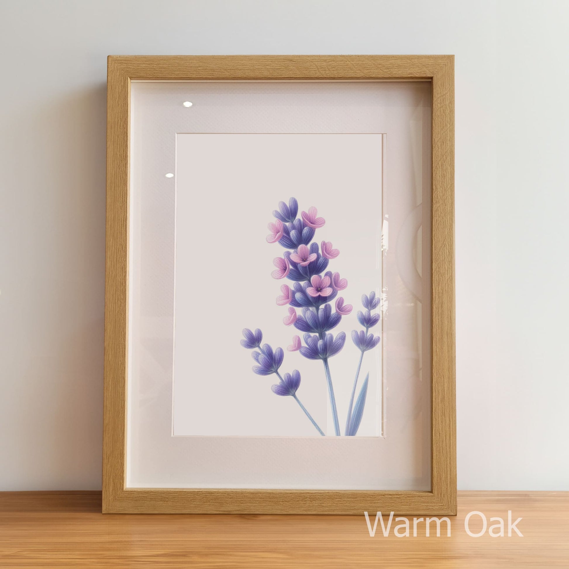 Framed artwork of lavender flowers with a warm oak frame on a light background