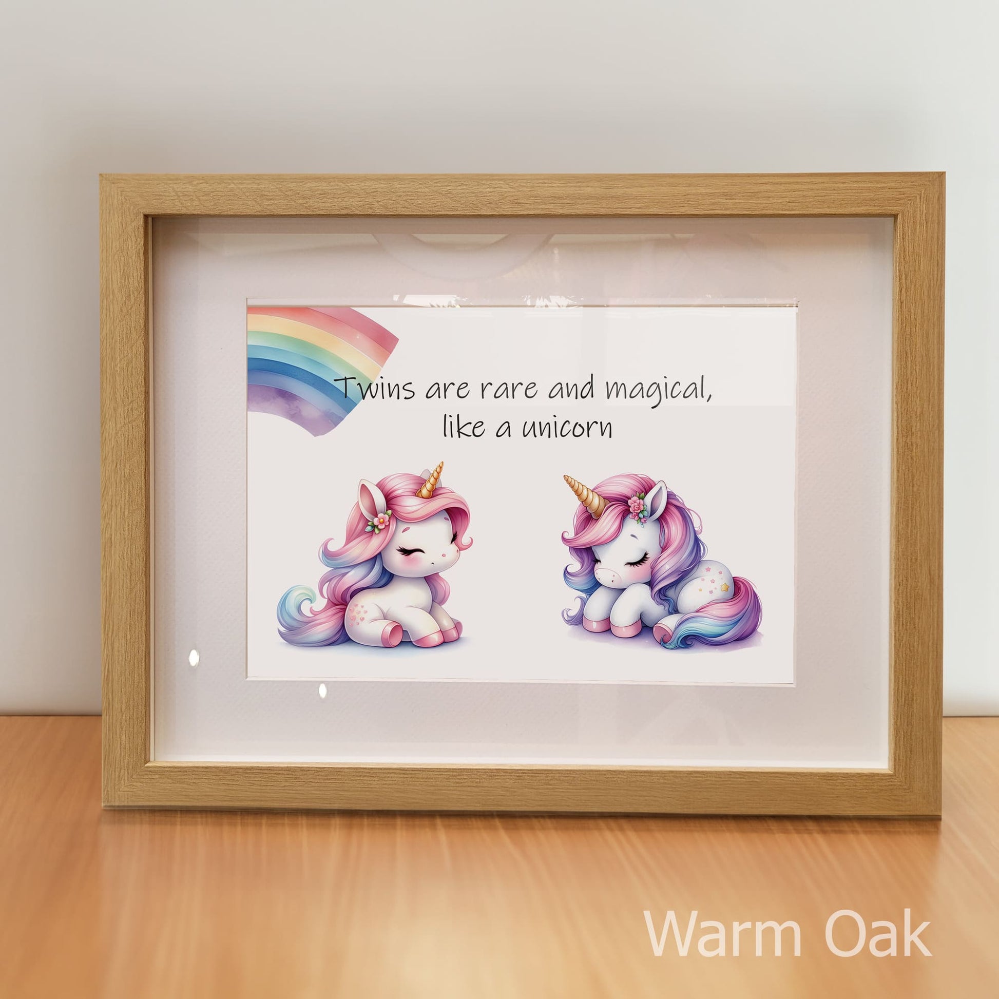 Framed artwork with unicorns and text on a wooden surface, branded 'Warm Oak'.