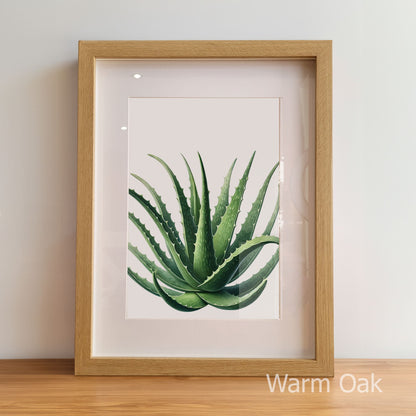 Framed artwork of a green plant on a light background