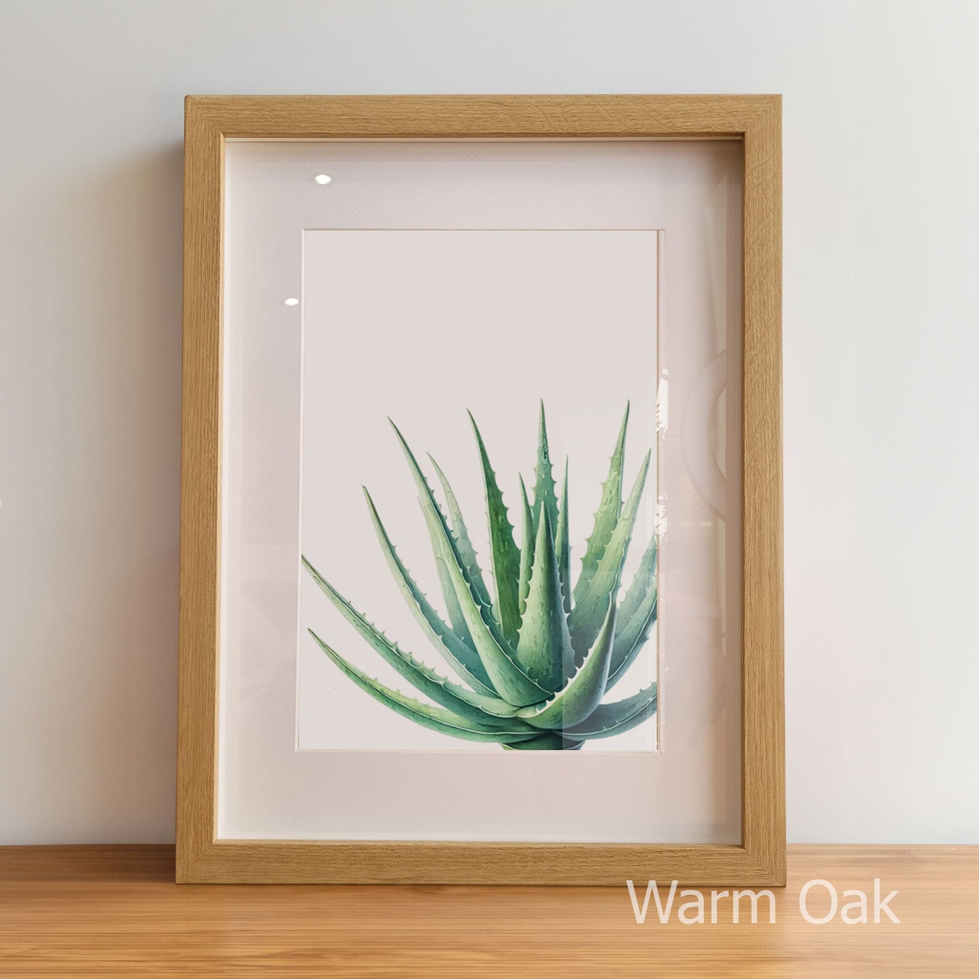 Framed artwork of a green plant on a white background with 'Warm Oak' frame.