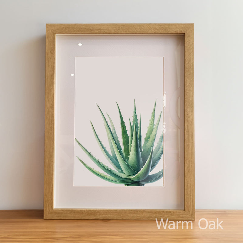 Framed artwork of a green plant on a white background with 'Warm Oak' frame.