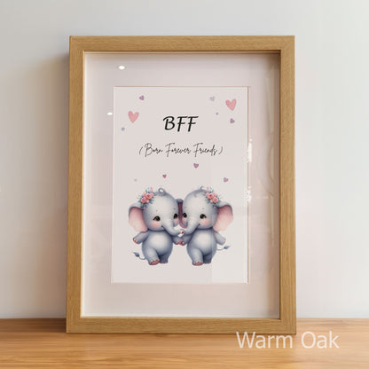 Framed artwork with two elephants holding hands and 'BFF' text on a light background.