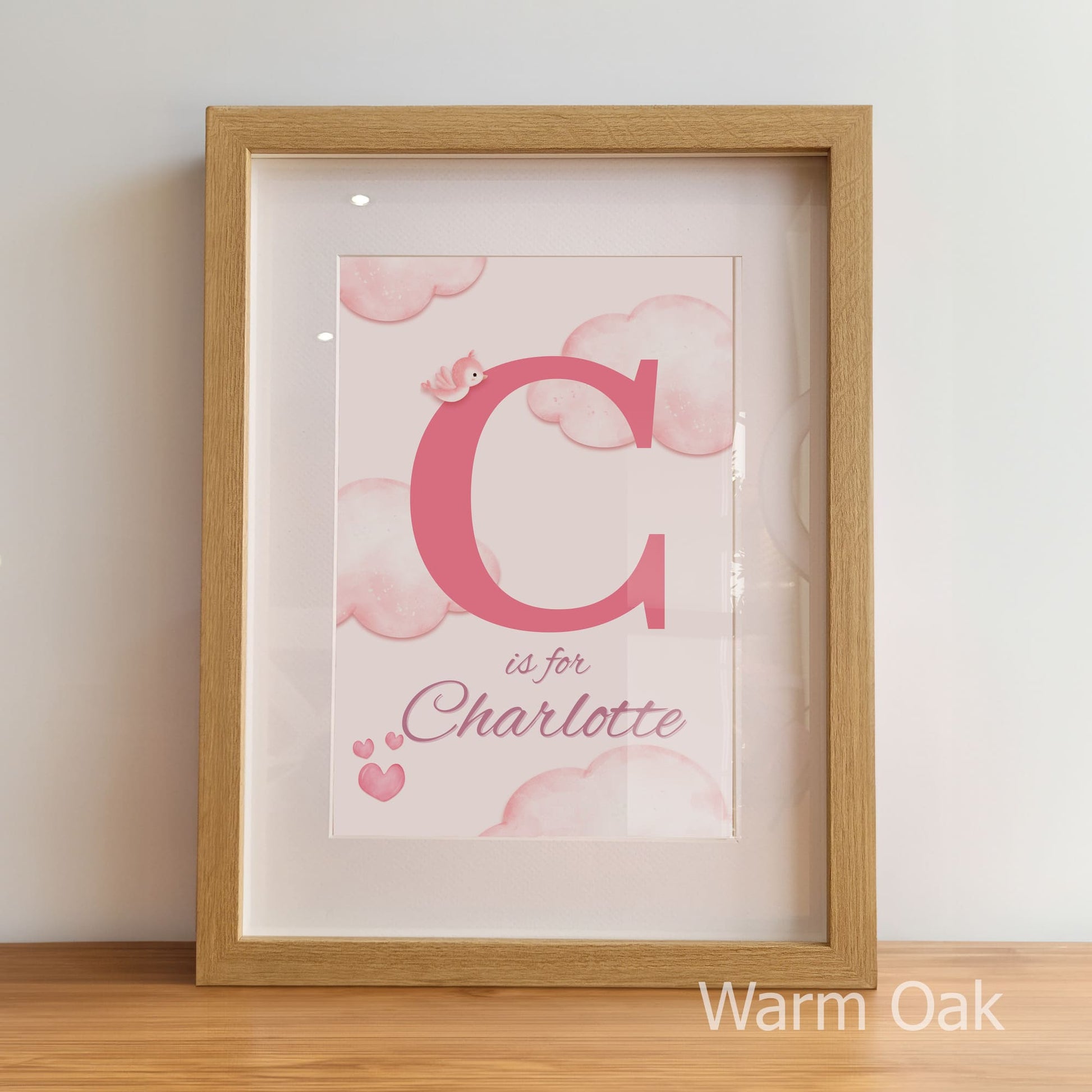 Framed artwork with 'C is for Charlotte' on a light background