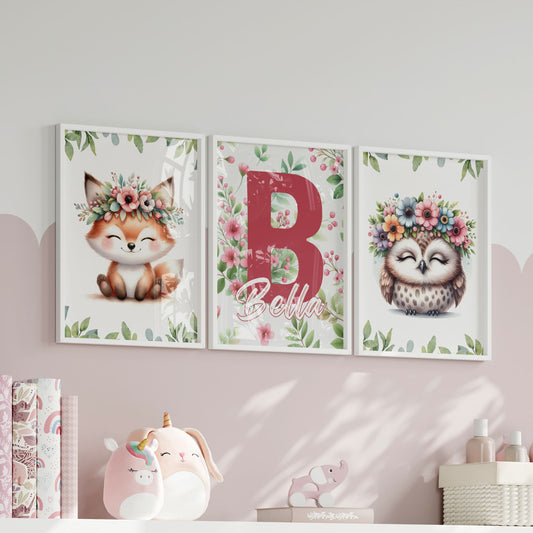 Three A4 Prints for childrens nursery. A cute fox and owl wearing flower crowns.The third print has a pink flower and leaf pattern, with a large dark pink inital letter and childs name written in white with dark pink outline