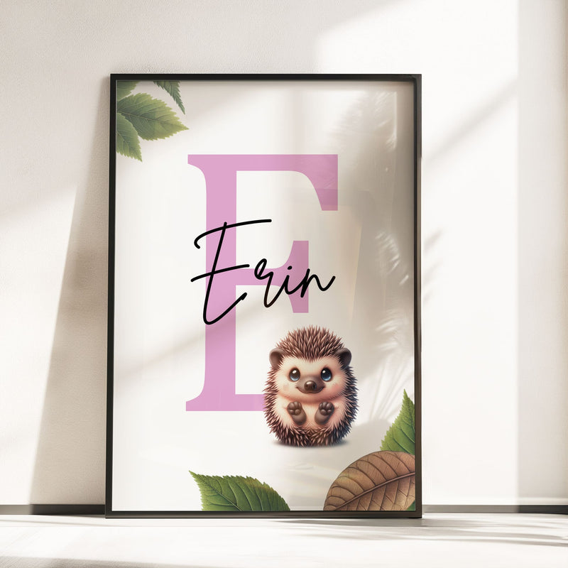 Set of three A4 prints featuring woodland baby animals - fox, badger, and squirrel. The animals are depicted in a cartoony style, resembling coloured pencil drawings. Woodland leaves decorate the edges of the prints. The middle print features a smaller animal than the others, with a large initial letter in the background. A personalised name in black overlays the initial letter.